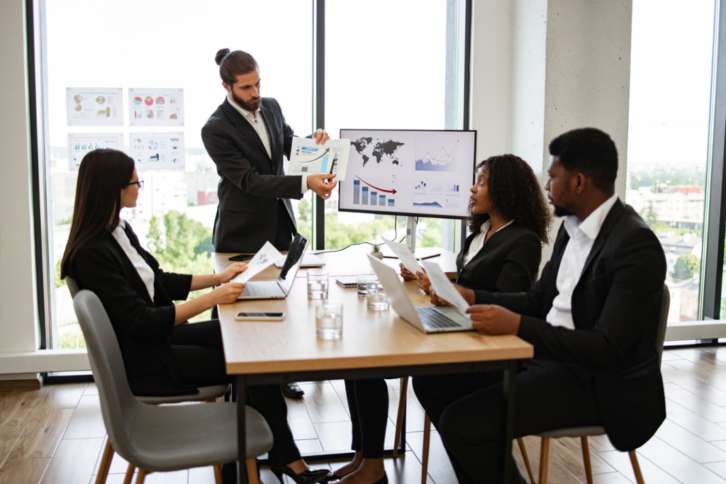 A group of professionals discussing in a conference room.