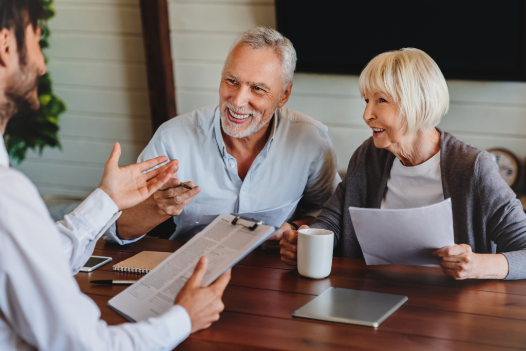 Older couple discussing their financial affairs with adviser