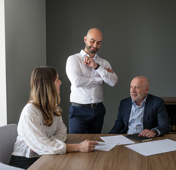 Three business people having meeting in a corporate office